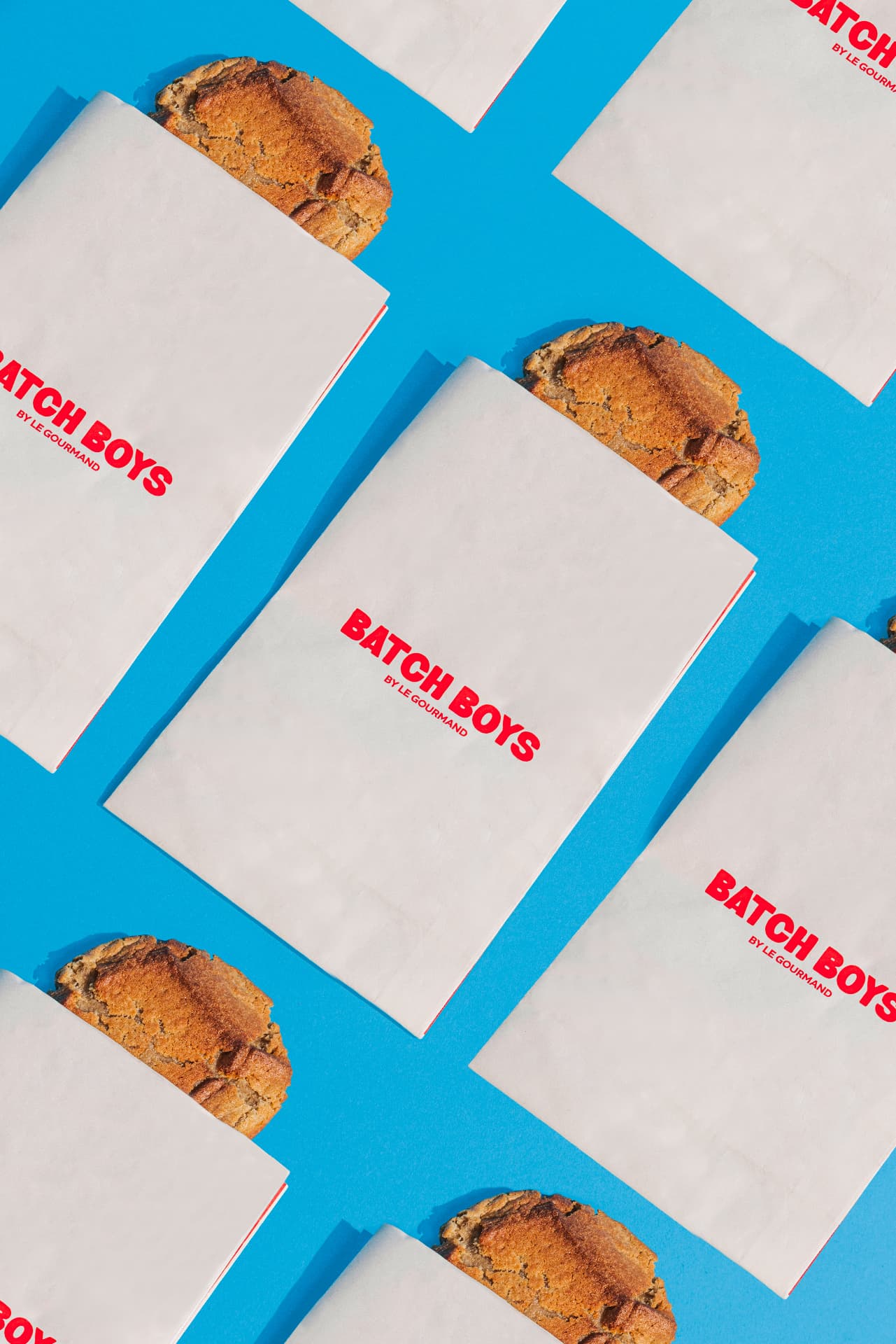 Batch Boys glassine cookie sleeves laid out on a blue background